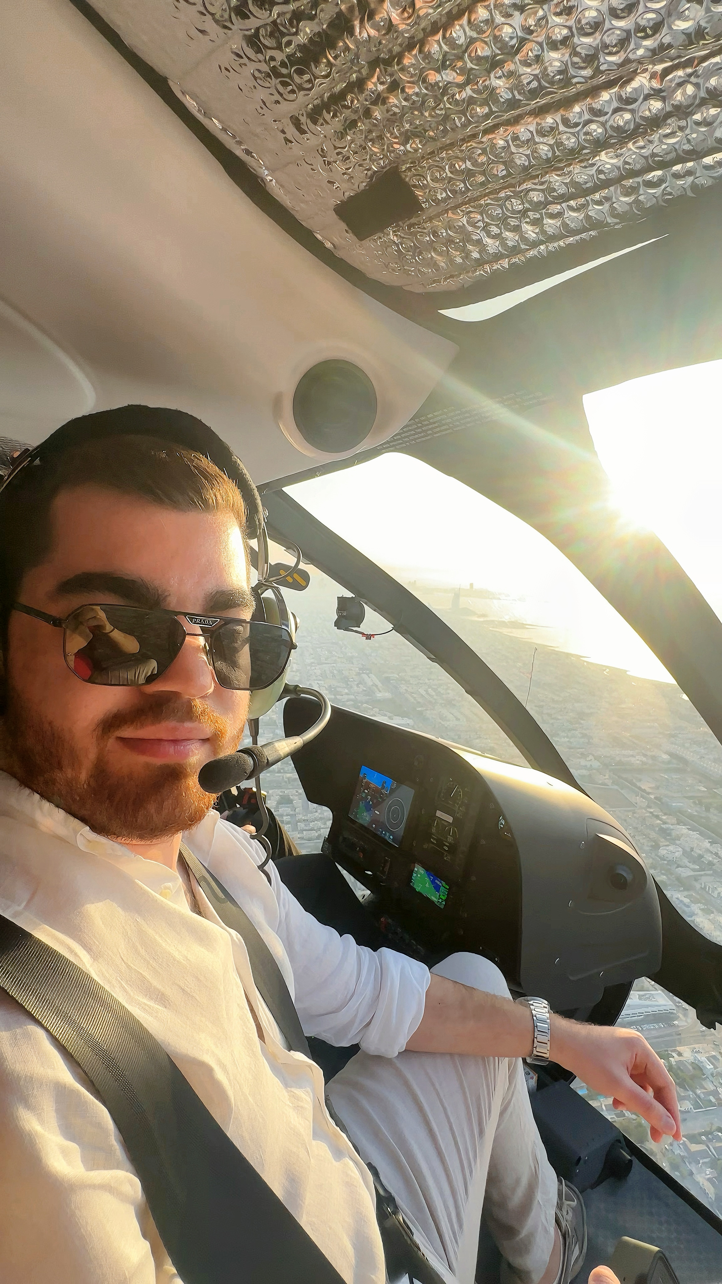 Cem Eren Metin in a helicopter cockpit